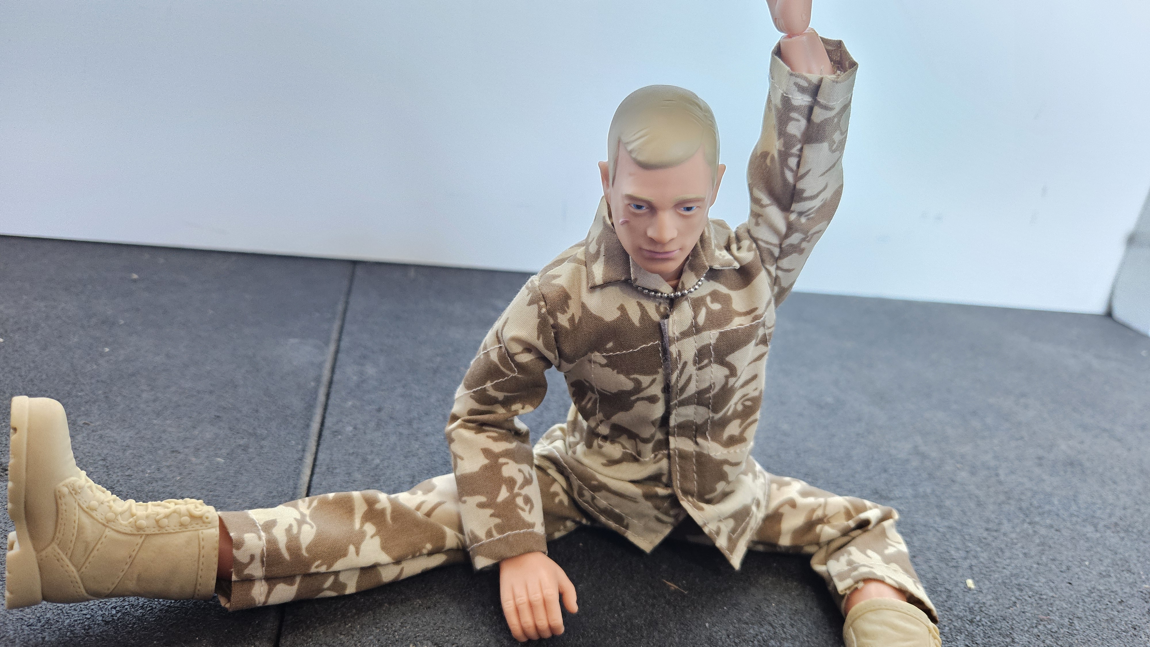 Action Man doing Revolved Head to Knee Pose